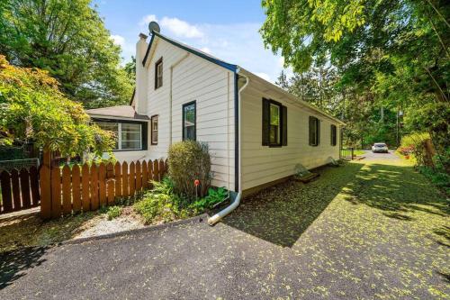 a small white house with a fence in a yard at 1255 Ashbridge, West Chester, PA in West Chester