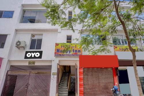 a building with aoked sign on the front of it at Super OYO Hotel Happy Inn in Patna