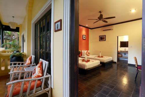 a view of a room with two beds at Residence Indochine D'angkor in Siem Reap