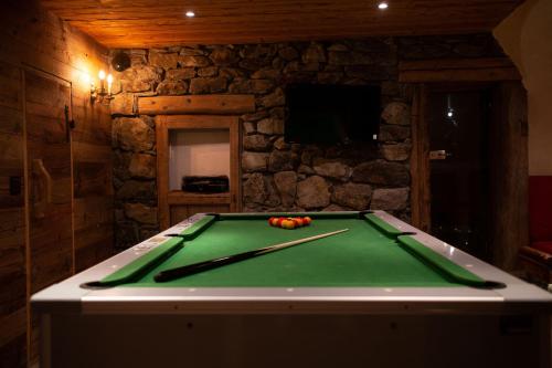 a pool table with balls on top of it at Le Bûcher d'Albert in Champagny-en-Vanoise