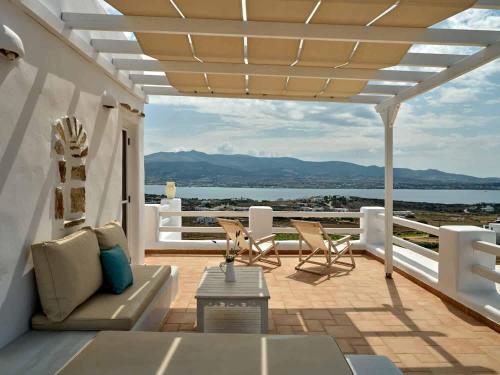 a patio with a view of the water and mountains at Antiparos View in Antiparos