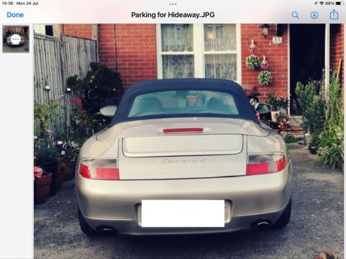 a silver car parked in front of a house at Lyme Clifftop Hideaway in Lyme Regis