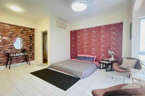 a bedroom with a bed and a brick wall at 3BR 8PAX KL City Centre KLCC View Ampang Boulevard Condo in Ampang