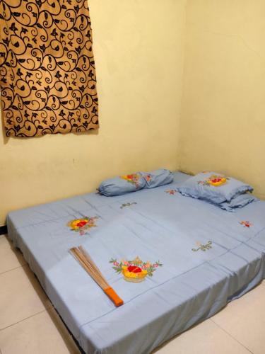 מיטה או מיטות בחדר ב-pentung homestay