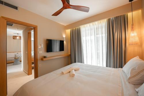 Postel nebo postele na pokoji v ubytování Trinity Design Suites