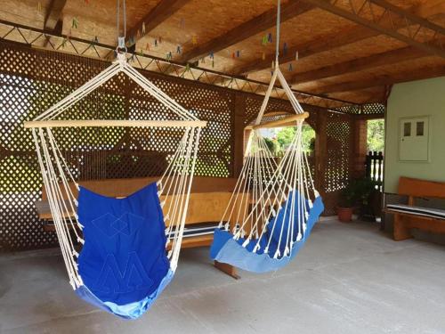 two hammocks hanging from a ceiling in a room at ANA in Gračac