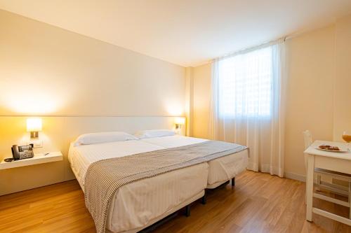 Postel nebo postele na pokoji v ubytování Hotel Rosella affiliated by Intelier