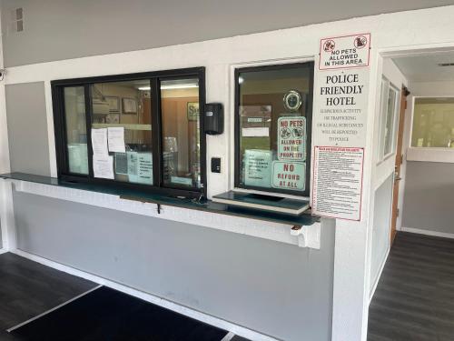 a police emergency room with two windows and a sign at Superlodge in New Castle