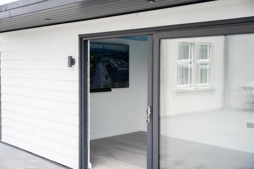 an open garage door in a house at Escape Ordinary at Lily's Pad in Enniskillen