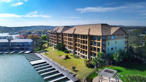 an aerial view of a building next to the water at Horseshoe Bay Resort in Horseshoe Bay