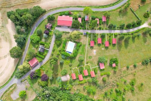 an overhead view of a house and a road at Les Cabanes Parisiennes - Chalets 1h30 from Paris - 62P in Sainte-Geneviève-des-Bois