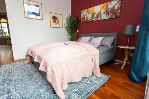 a bedroom with a bed and a couch at FullHouse - Leipzig - M14 Apartments - Balcony - SmartTV in Leipzig