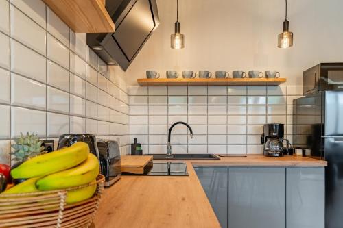 a kitchen with a bunch of bananas on a counter at Osada Zbójnicka Turnia in Kościelisko