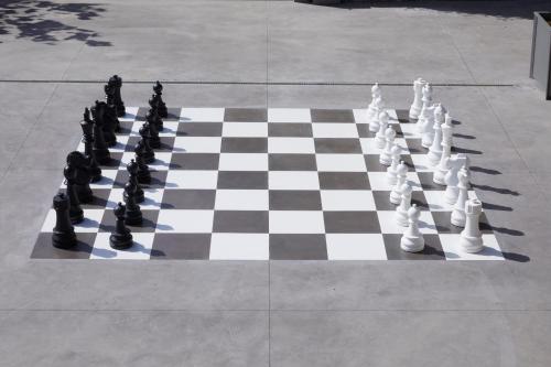 a chess board on a sidewalk with a chess board at Borgo San Gregorio in Sorbo Serpico