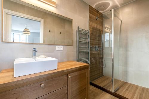 a bathroom with a sink and a shower at Beautiful Beach house in front of the Ocean in Biarritz