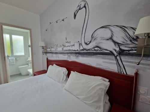 Ein Bett oder Betten in einem Zimmer der Unterkunft Logis VIGNES BLANCHES*** Hôtel Cosy et restaurant de terroir