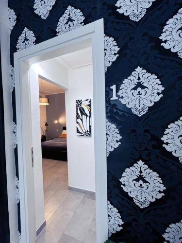 a hallway with a blue and white wall at Pit stop Ciampino Station in Ciampino