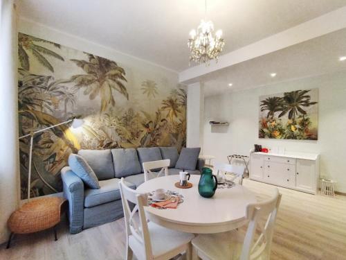 a living room with a couch and a table at Colleoni 19 Bangkok, appartamento superior in Civitanova Marche