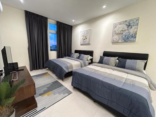 Postel nebo postele na pokoji v ubytování Studio 4 pax - Riverine Diamond Kuching