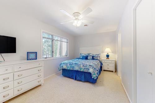 a bedroom with a bed and a ceiling fan at Villas of Bethany West - 792B Salt Pond Circle in Bethany Beach