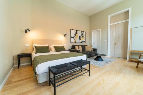 Ένα ή περισσότερα κρεβάτια σε δωμάτιο στο The Rex Hotel Porto