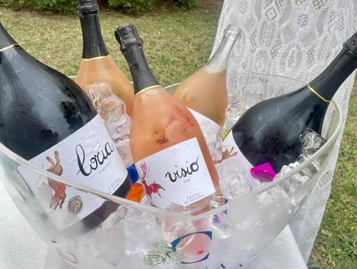 four bottles of wine in a basket at Cruna di Subida Wine Country House in Cormòns