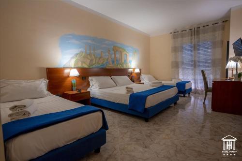 Katil atau katil-katil dalam bilik di Hotel Tempio
