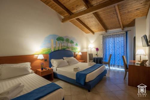 Katil atau katil-katil dalam bilik di Hotel Tempio