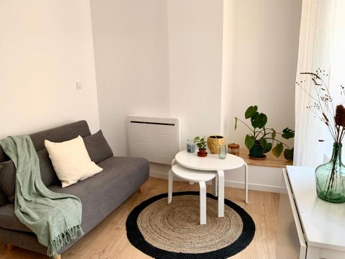 Кът за сядане в Appartement cosy au coeur de Tournon