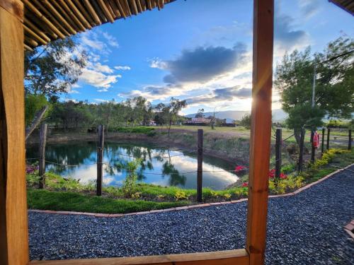 a view of a river from a porch at Glamping El Muelle in Villa de Leyva