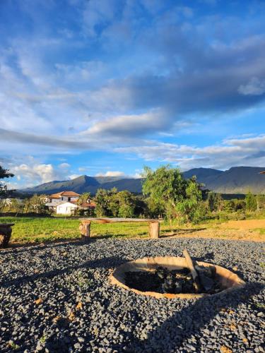 a large hole in the middle of a gravel road at Glamping El Muelle in Villa de Leyva