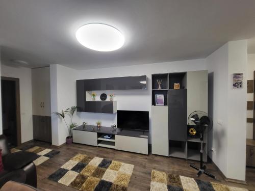 a living room with a couch and a table at Subcetate Residence in Bistriţa
