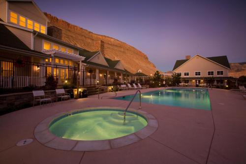 a large swimming pool in front of a building at Wine Country Inn in Palisade