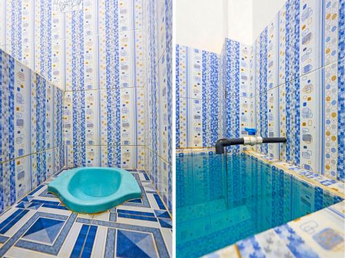 un baño con una piscina con edificios en SPOT ON 92786 Homestay Barokah, en Gresik