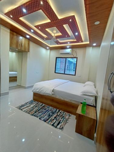 a bedroom with a bed in a room at The Royal Sahdeo Venue in Gaya