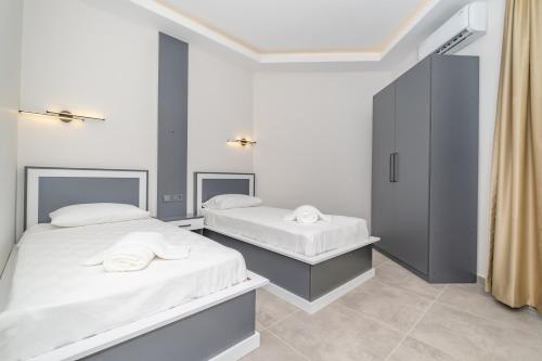 Postel nebo postele na pokoji v ubytování Pera Side Hotel