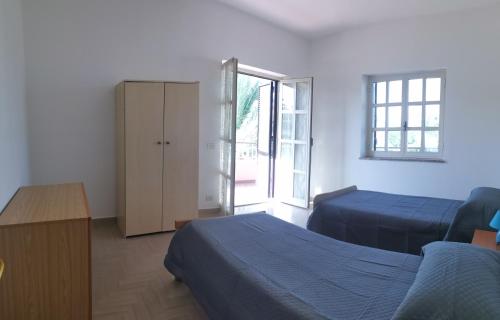 Postel nebo postele na pokoji v ubytování Le Palme di Riace 1