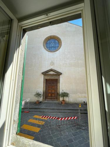 a view of a church with a door at Charming house in San Niccolò in Florence