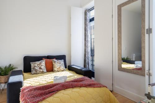 a bedroom with a bed and a mirror at Luxury Design Apartment - Premium Location in Porto