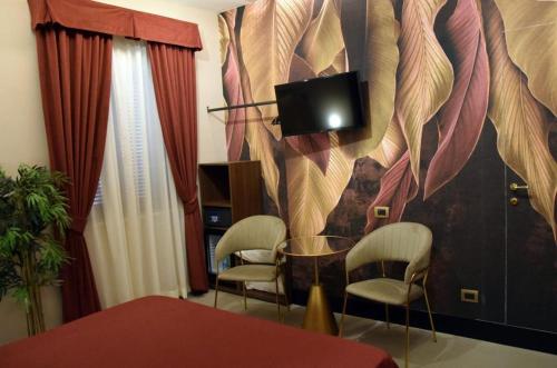 TV a/nebo společenská místnost v ubytování Hotel Vogue