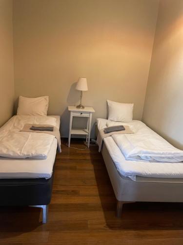 Säng eller sängar i ett rum på Lindelunda