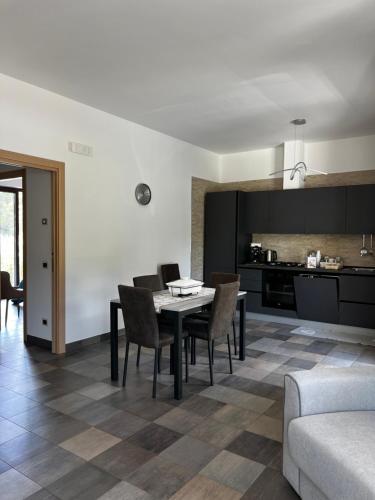 a kitchen and dining room with a table and chairs at Dimora Di Bari in Selva di Fasano