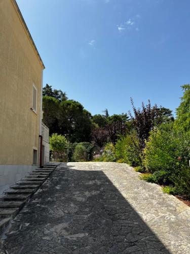 a stone road next to a building at Dimora Di Bari in Selva di Fasano
