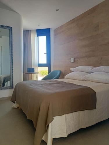 En eller flere senger på et rom på Apartamento Santiago de La Ribera