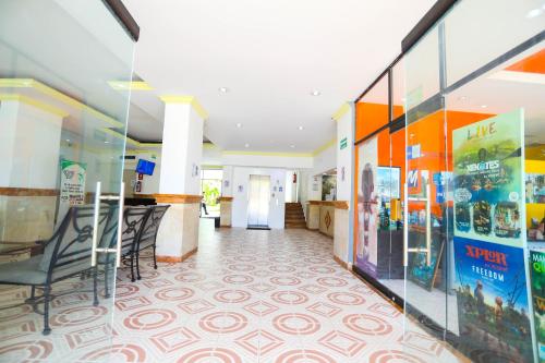 a hallway with chairs and a lobby with colorful walls at Hotel Caribe Internacional Cancun in Cancún