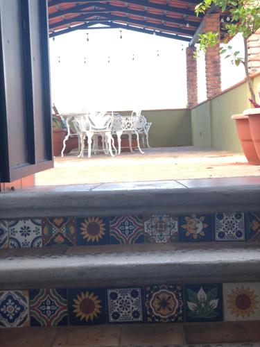 an outdoor patio with tiles on the stairs at Mountain View Lofts Guayabitos in Rincon de Guayabitos