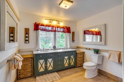 a bathroom with a sink and a toilet and a window at Stunning Ouray Escape with Panoramic Mountain Views! in Ouray
