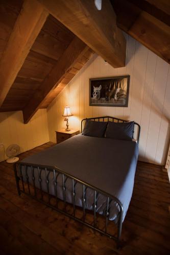 a bedroom with a large bed in a attic at The Viking Lodge - Downtown Winter Park Colorado in Winter Park