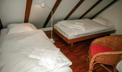 En eller flere senger på et rom på Huisje Smuk