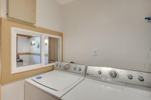 a washing machine in a kitchen with a mirror at Beautiful Ouray Home with Patio - 3 Mi to Downtown! in Ouray